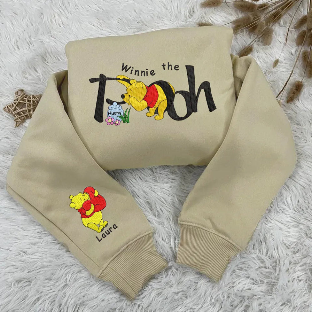 Sand Sweatshirt Winnie The Pooh Embroidered Folded On Fuzzy Surface. 