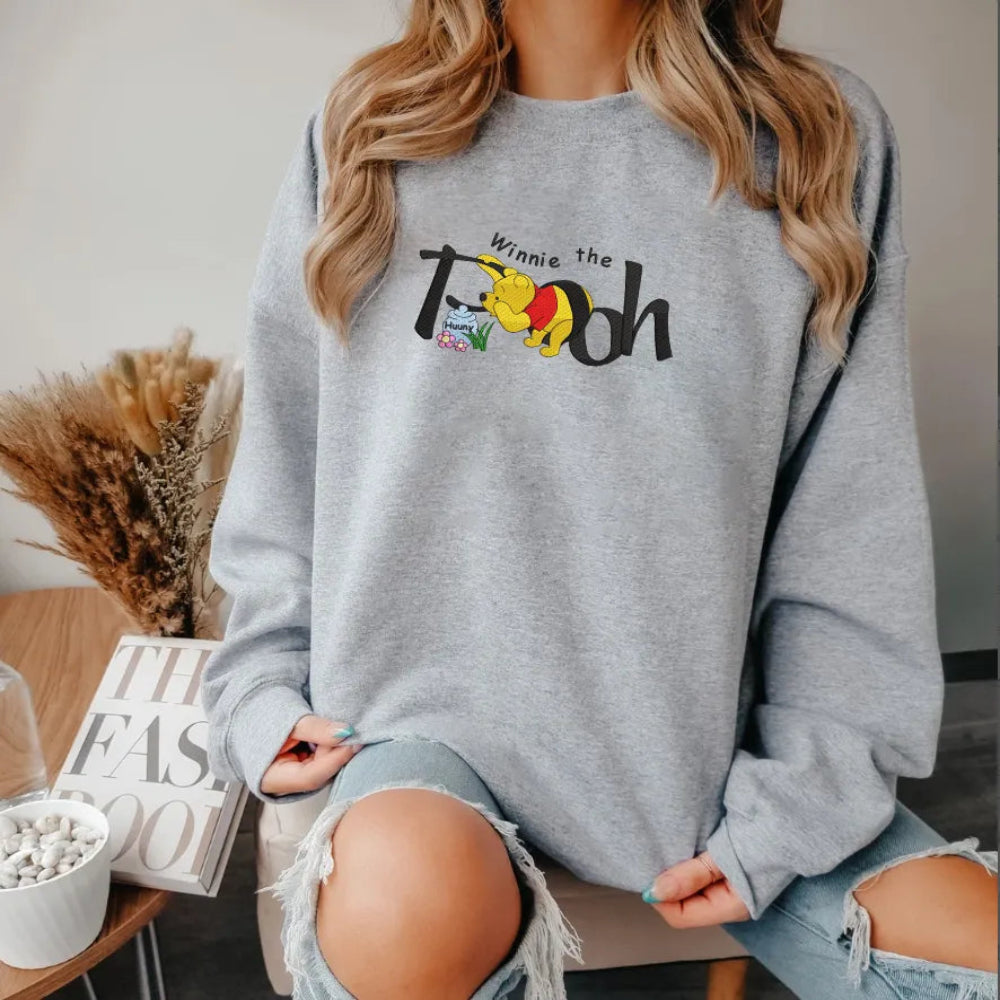 Sweatshirt Winnie The Pooh Hunny Embroidered On Model With Mug.