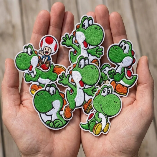 Close-Up Hand Showing Yoshi Eating Melon Patch Among Other Yoshis